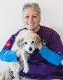 Harmony Veterinary Center - office manger Karen holding a dog