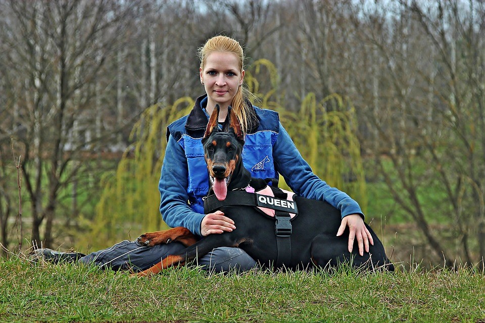 woman with doberman pinscher